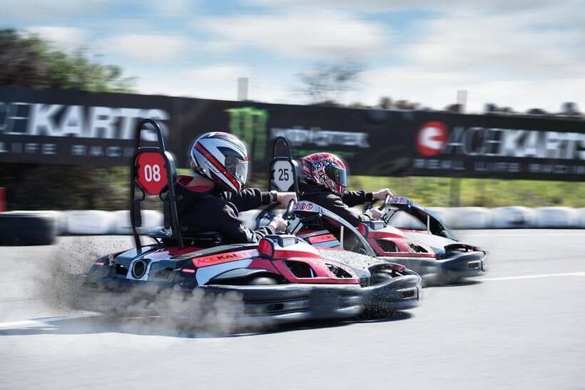 Go-karts racing side by side on the track